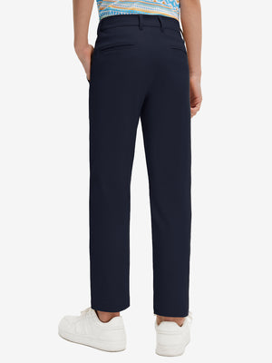 Back lower body view of model wearing the navy youth water resistant cotton blend golf pants, highlighting the rear design