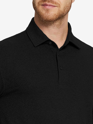 Collar detail of Skin-friendly long sleeve melange polo with soft touch in black