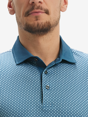 Close-up: nose to chest in blue small flower lightweight stretch upgraded print golf polo shirts