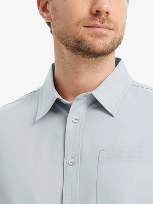 Front view from nose to chest showcasing the crisp GLACIER GREY polo.