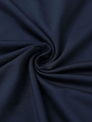 Close-up of navy everyday solid jersey polo fabric showing soft knit texture and smooth surface.