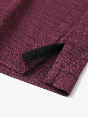 Close-up of hem opening on Modern Fit Melange Polo in WINE HEATHER, showcasing fine stitching and design