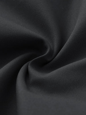 Close-up of fabric on water resistant versatile 8 pockets shorts, showing texture and finish in dark grey.
